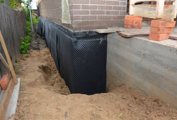 Happy homeowners after waterproofing job in Bellmore